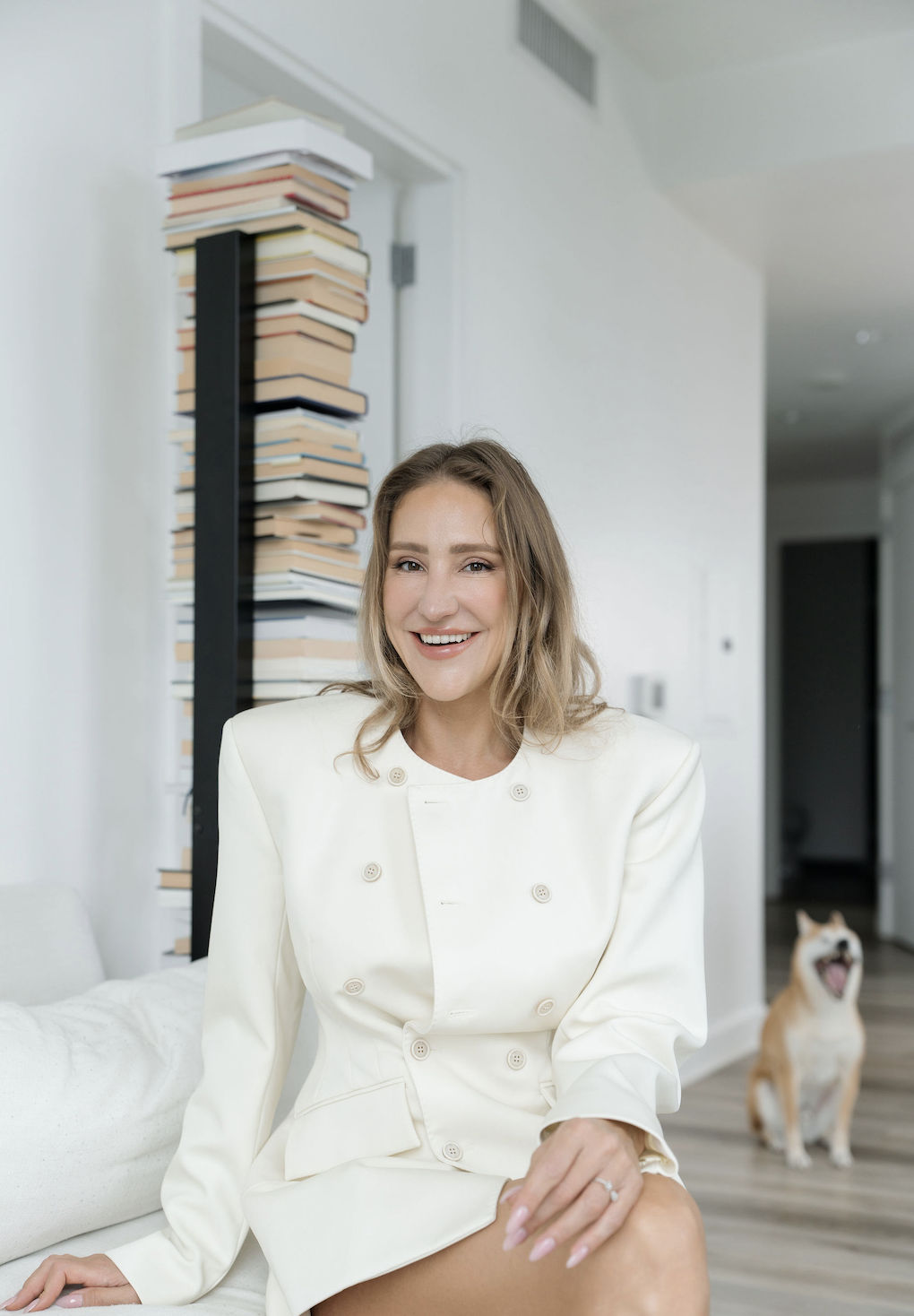 Kristina Subbotina at home beside a stack of books